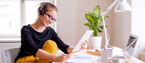 Student with headphone and laptop Student with headphone and laptop