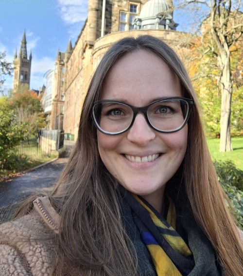 Dr Alex Dold standing smiling