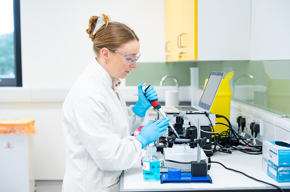 Scientist using lab equipment